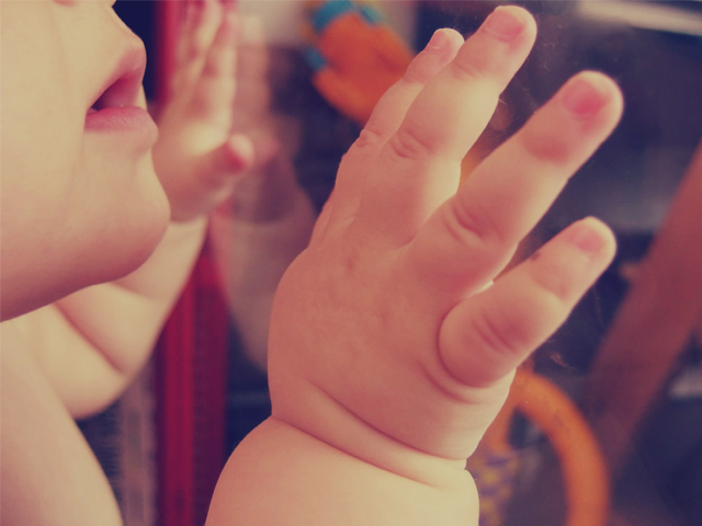 Baby Hand on Glass